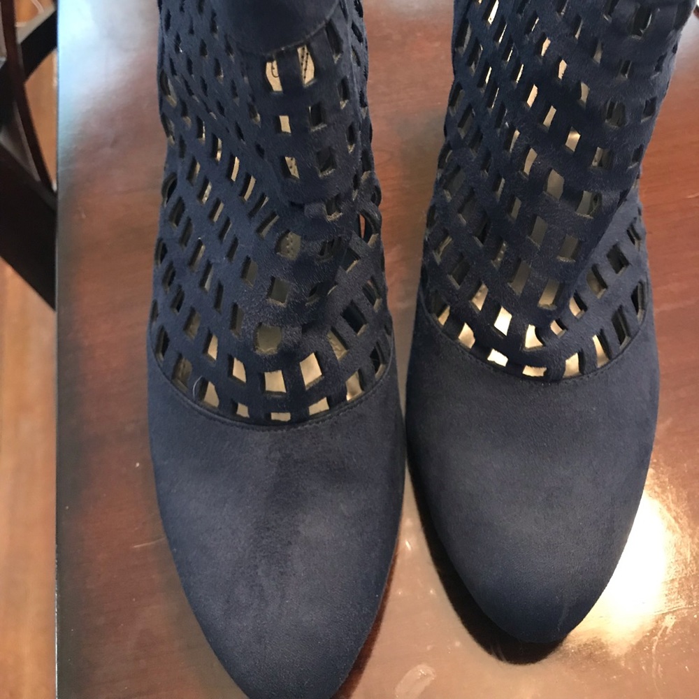 Blue suede 2 inch heels w laser cutouts.